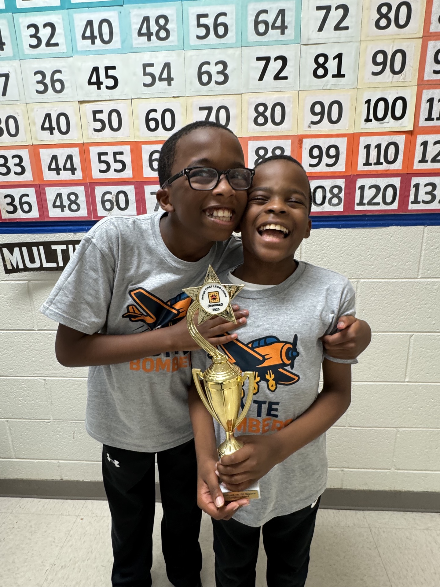 Byte Bombers students celebrating their trophy win